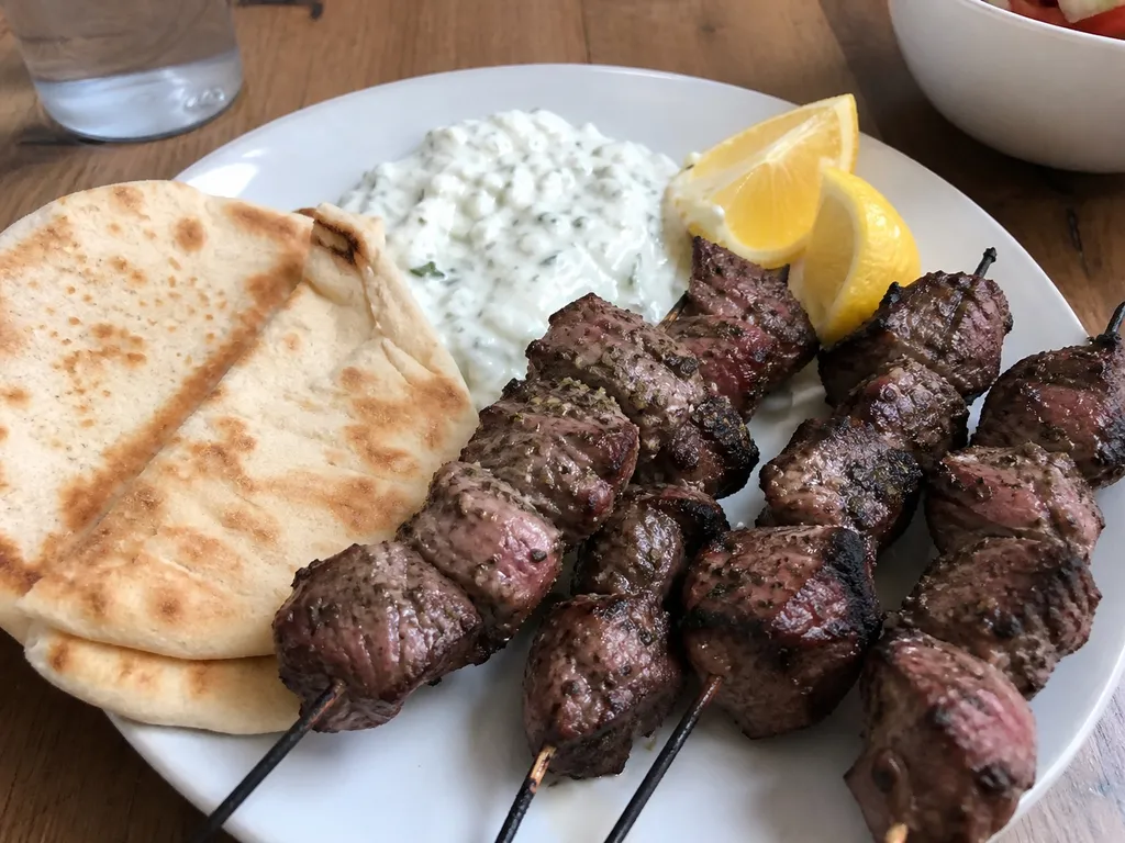 Arni Souvlaki (Grilled Lamb Skewers) — plated and served