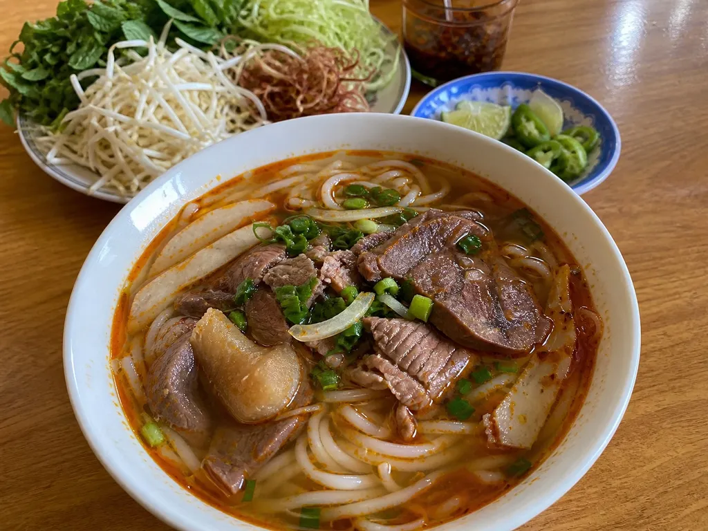 Bún Bò Huế (Spicy Beef Noodle Soup) — plated and served