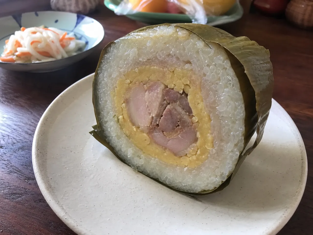 Bánh Tét (Cylindrical Sticky Rice Cake) — served