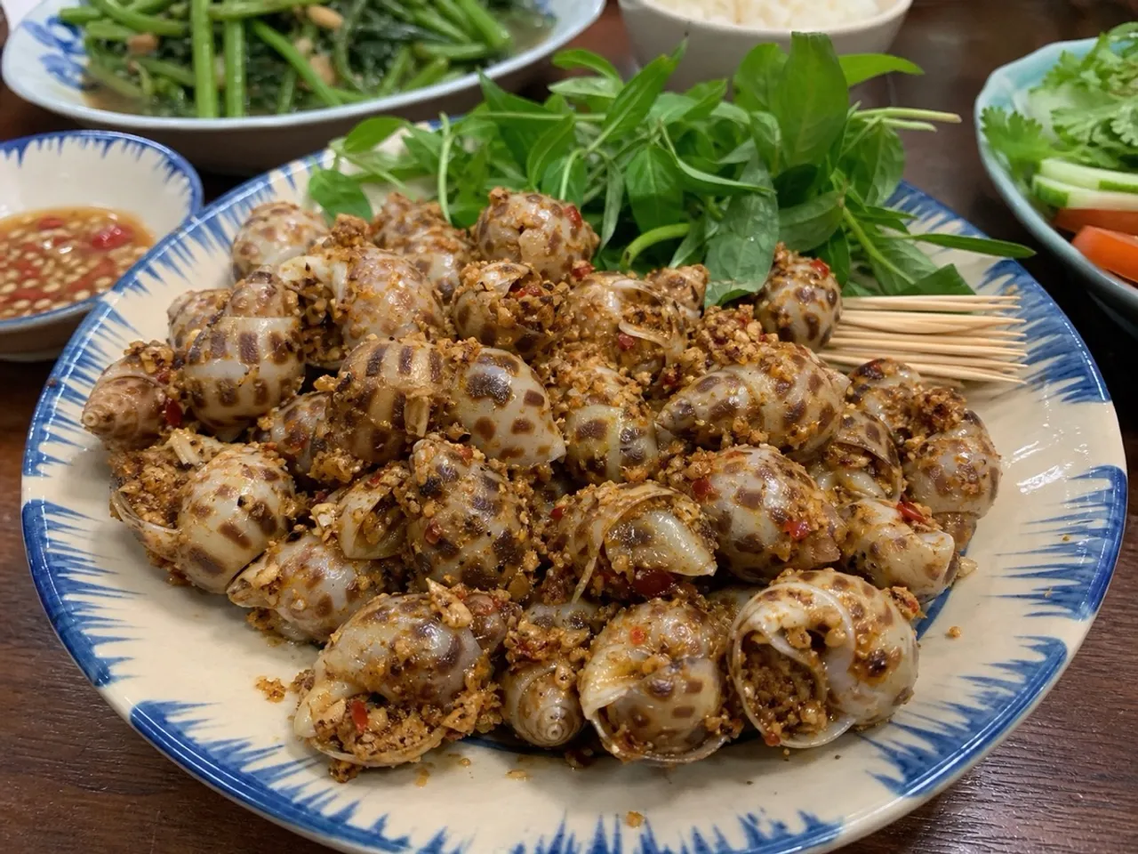 Ốc Hương Rang Muối (Salt-toasted Sea Snails) — served