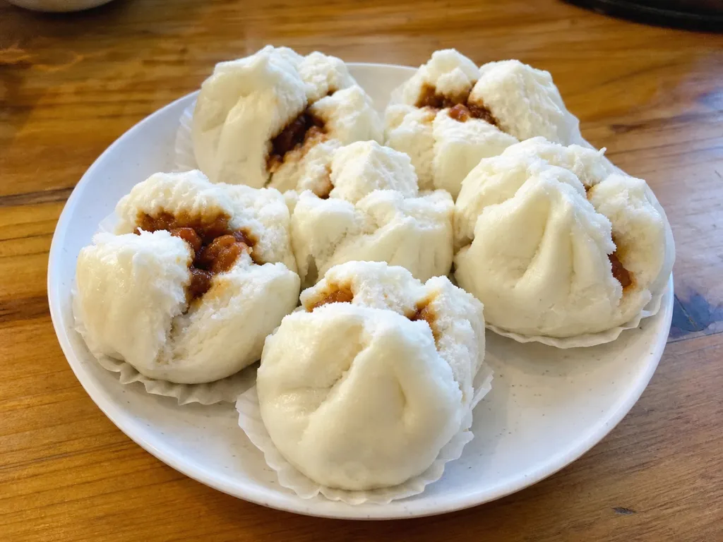 Char Siu Bao (Steamed BBQ Pork Buns) — plated and served