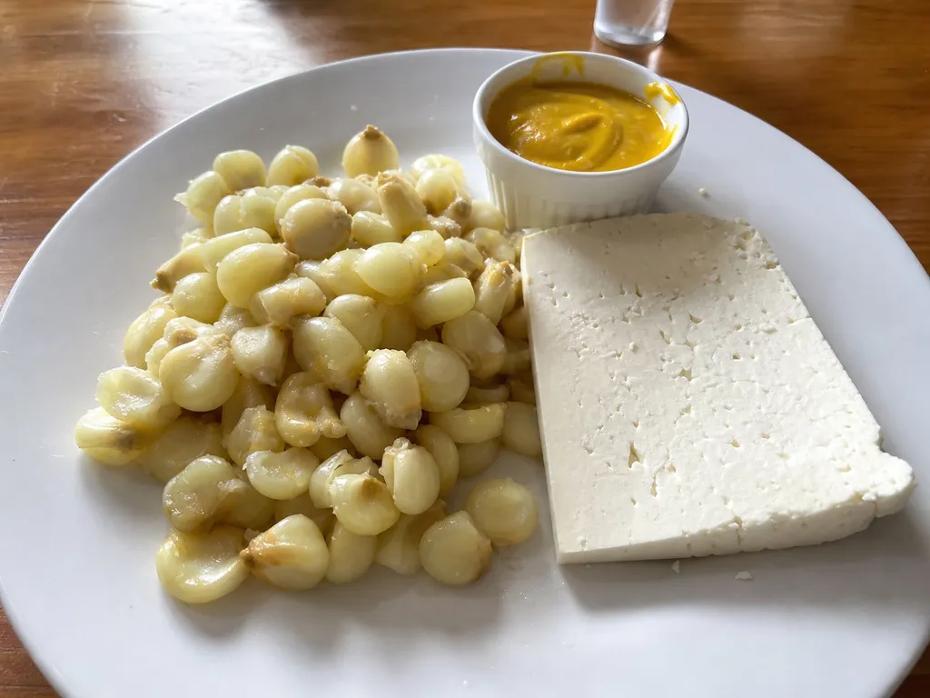 Choclo con Queso (Peruvian Corn with Cheese) — plated and served