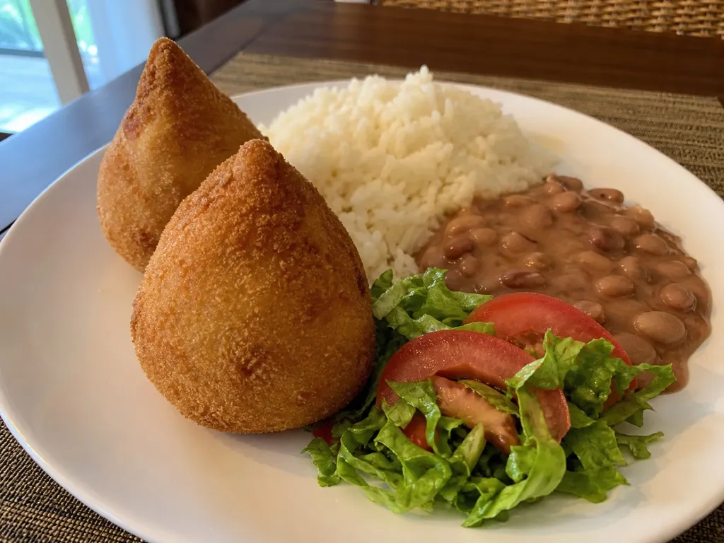 Coxinhas (Chicken Croquettes) — plated and served