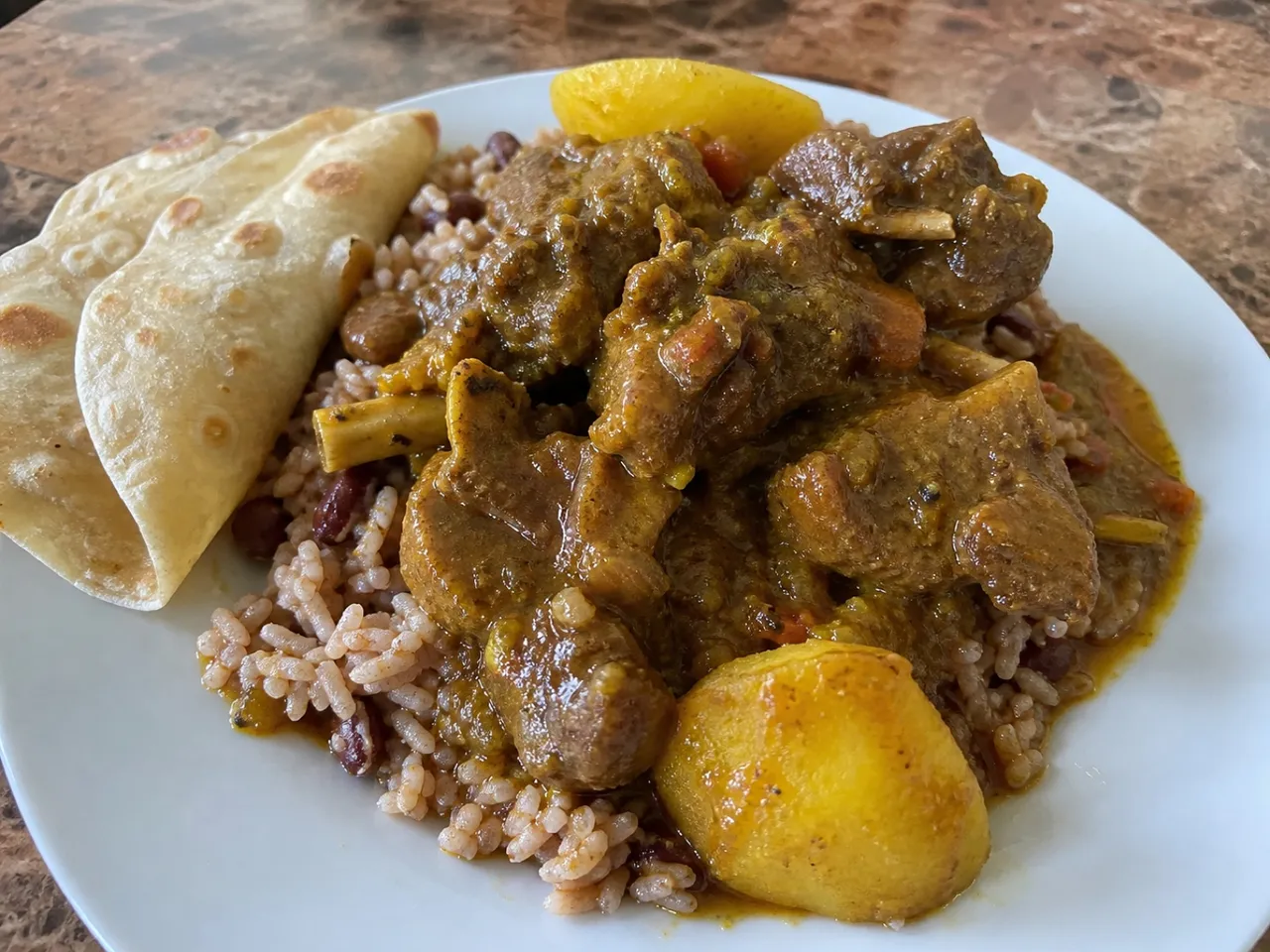 Curry Goat — served