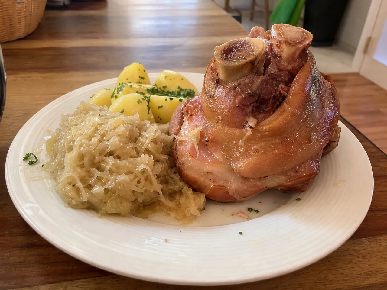 Eisbein (Boiled Pork Knuckle with Sauerkraut) — served
