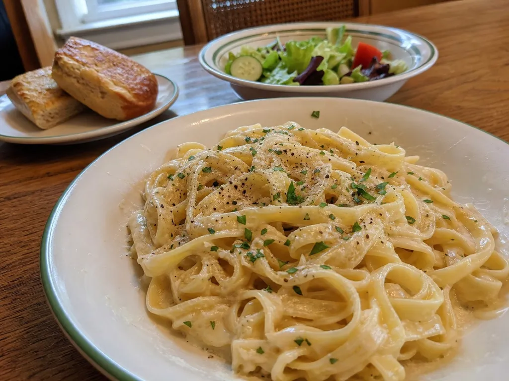 Fettuccine Alfredo — plated and served