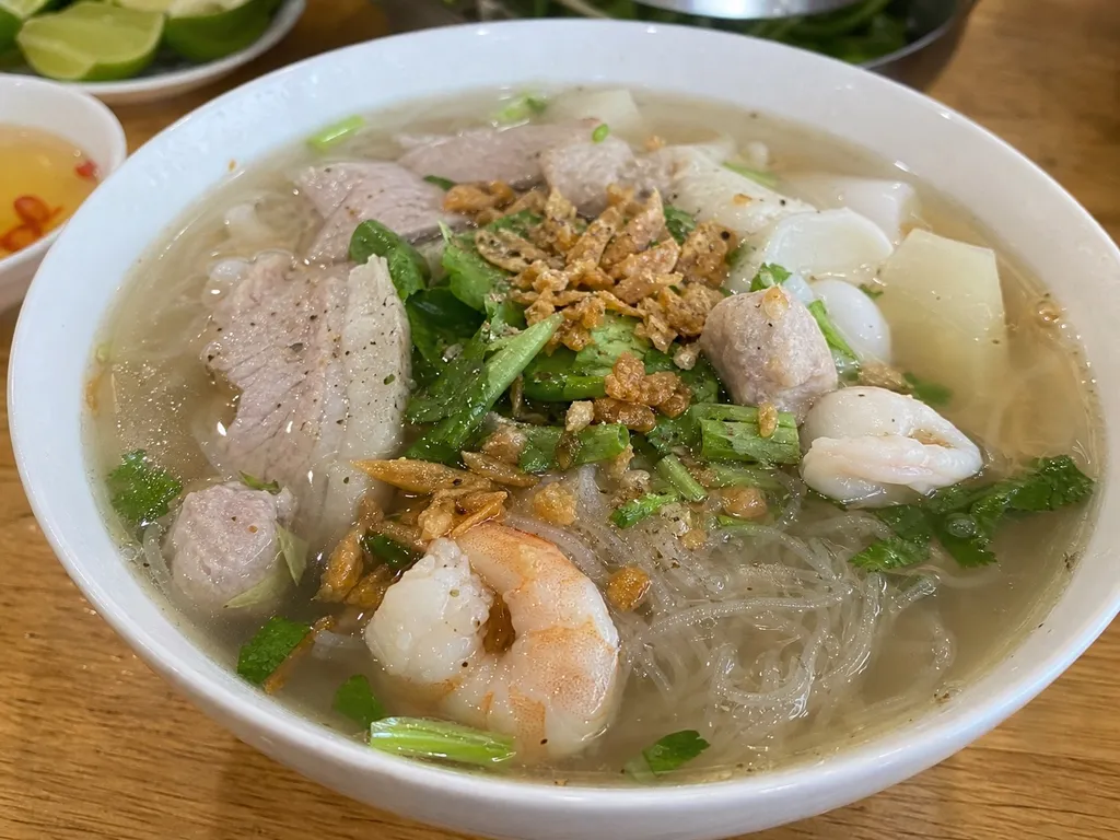 Hủ Tiếu (Pork and Seafood Noodle Soup) — plated and served