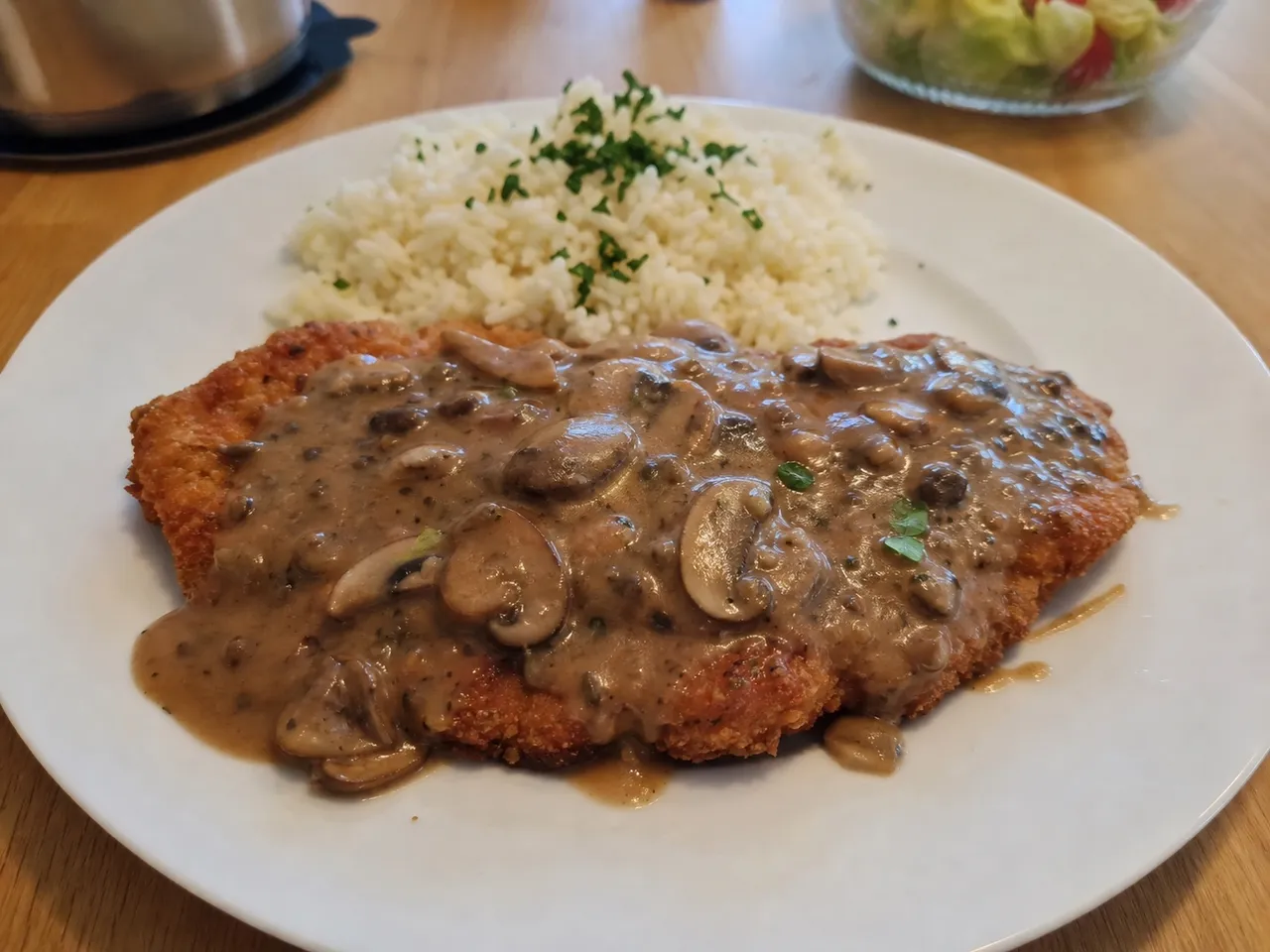 Jägerschnitzel (Hunter's Schnitzel with Mushroom Sauce) — served