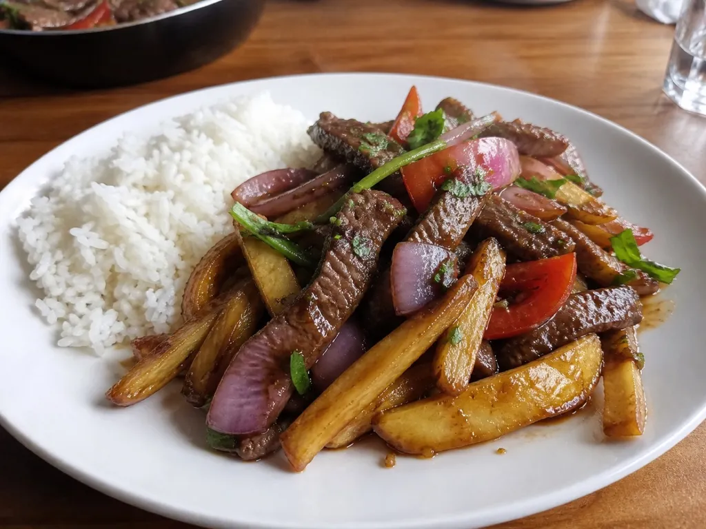 Lomo Saltado (Peruvian Beef Stir-Fry) — plated and served