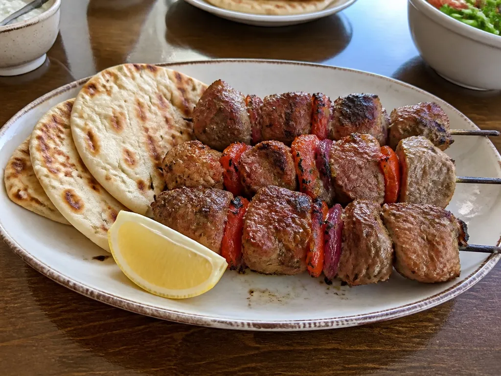 Pork Souvlaki Skewers — plated and served