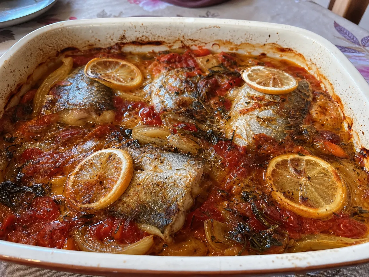 Psari Plaki (Baked Fish with Tomatoes and Vegetables) — served