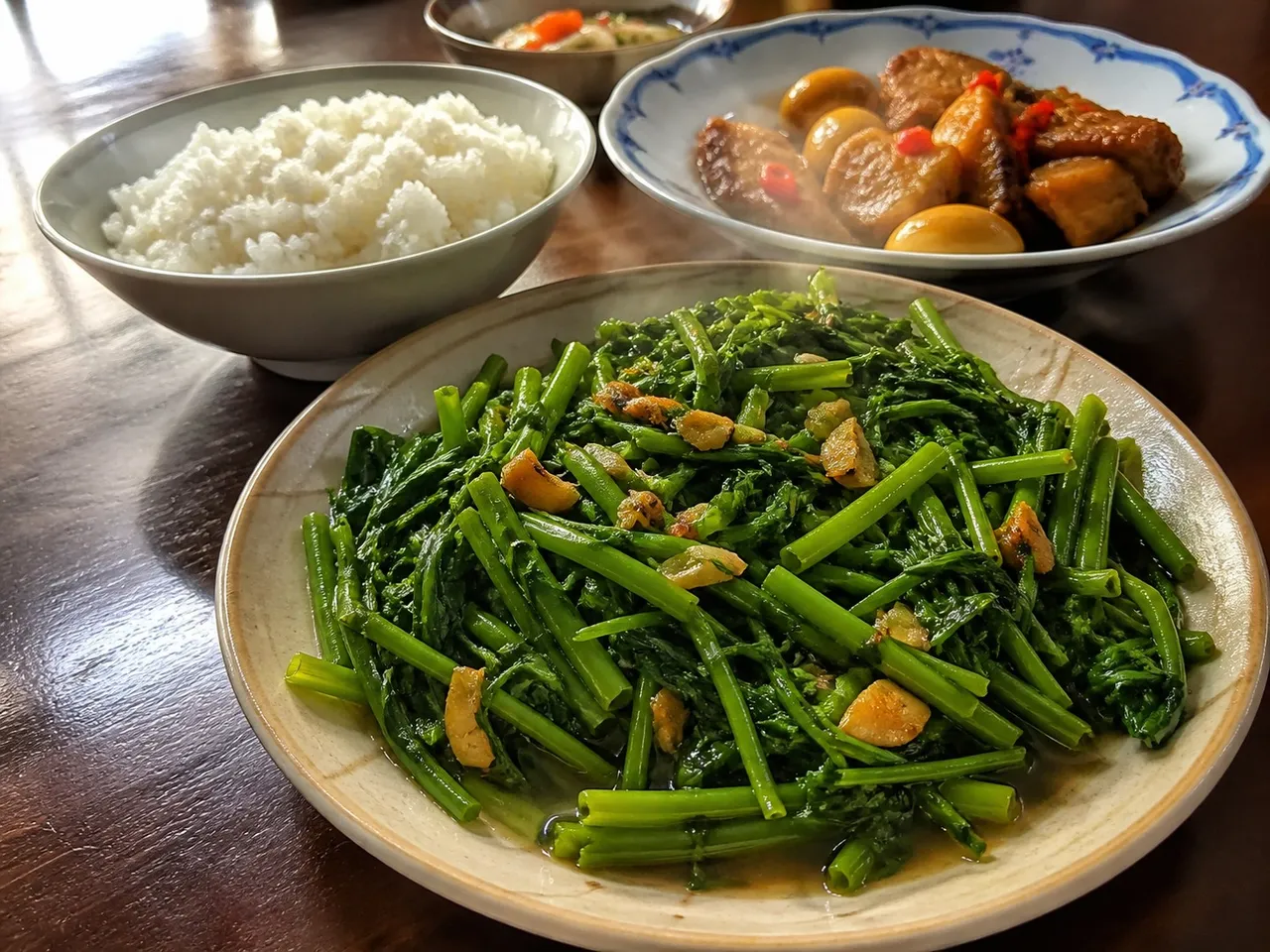 Rau Muống Xào Tỏi (Stir-fried Water Spinach with Garlic) — served