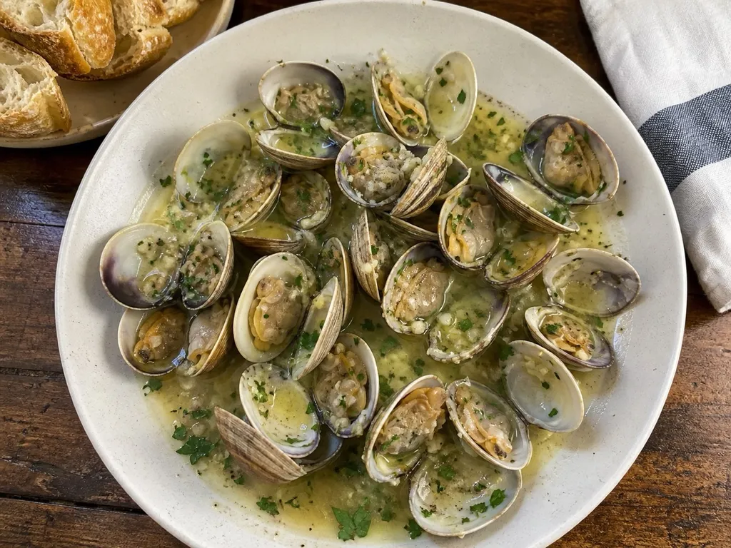 Steamed Clams in White Wine Broth — plated and served