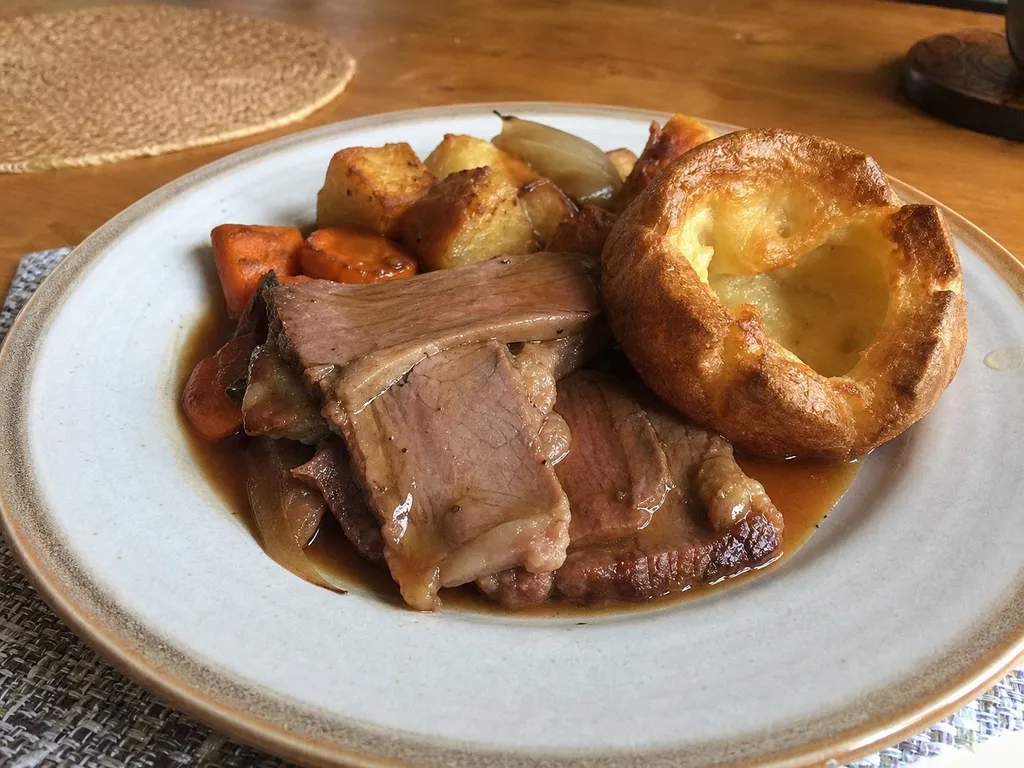 Traditional Roast Beef with Yorkshire Pudding — plated and served